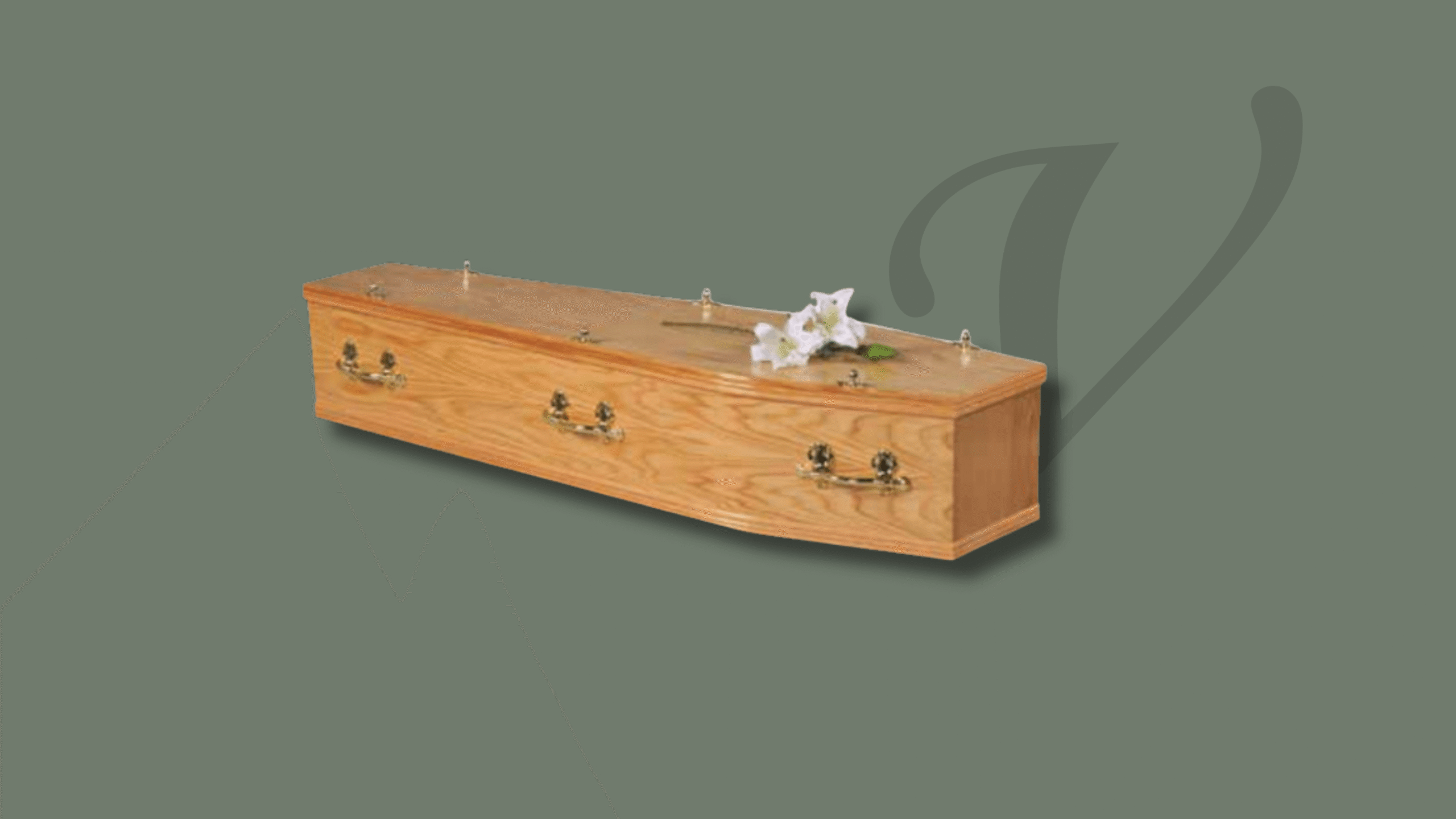 a coffin with white flowers on the top