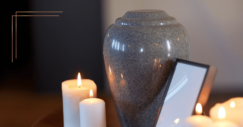 Image shows an urn with candles sat on a table top