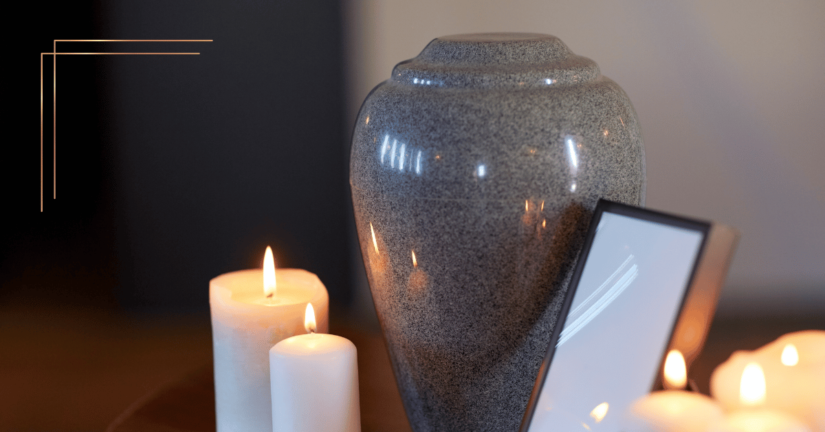Image shows an urn with candles sat on a table top